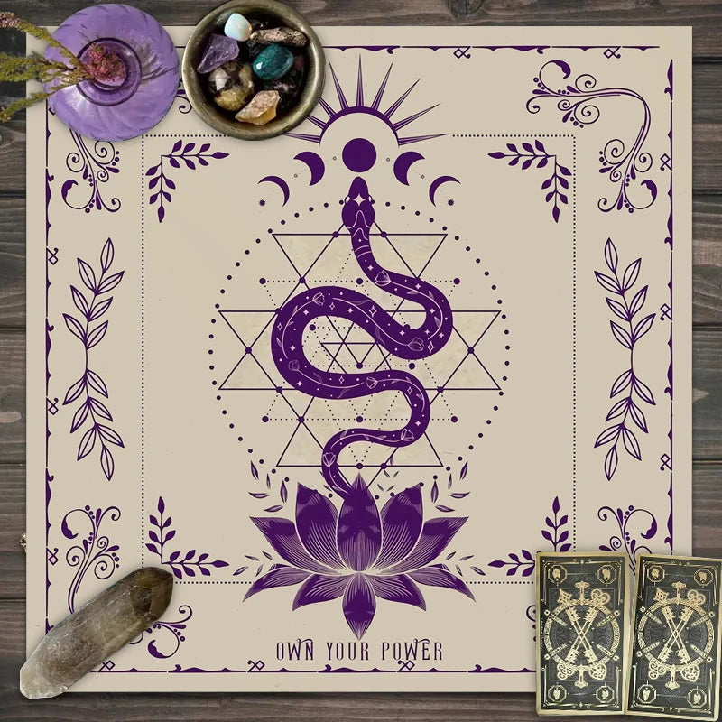 Beige tablecloth with purple serpent, lotus, and sacred geometry design.